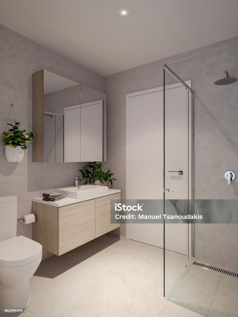 Bathroom Vanity, shower, semi-frameless glass shower, stone floor and wall tiling. Bathroom Stock Photo