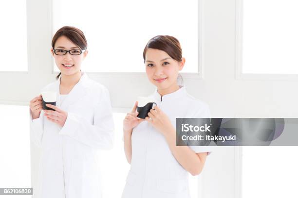 Young Asian Doctor In Hospital Stock Photo - Download Image Now - Adult, Adults Only, Breaking