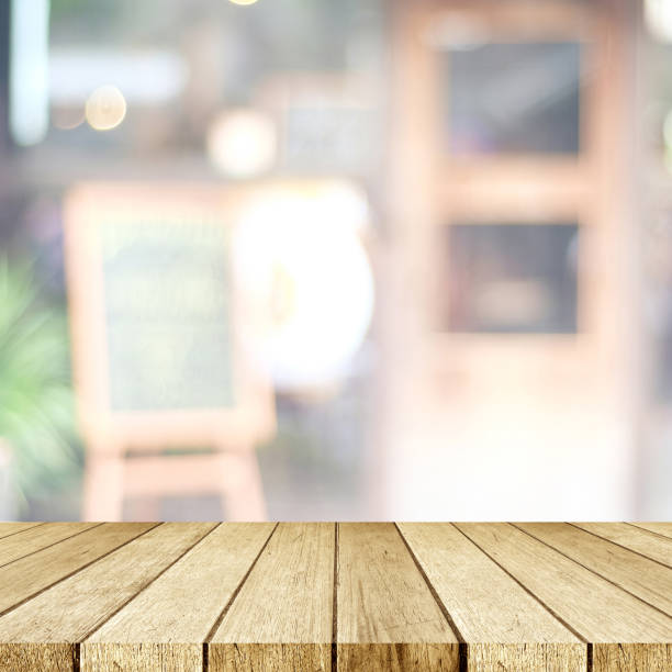 istock Empty perspective wood, tabletop, over blur restaurant with bokeh light background, food and product display montage background 862107704