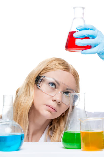 istock The chemist in glasses analyzes a liquid in test tubes is isolated 862111264
