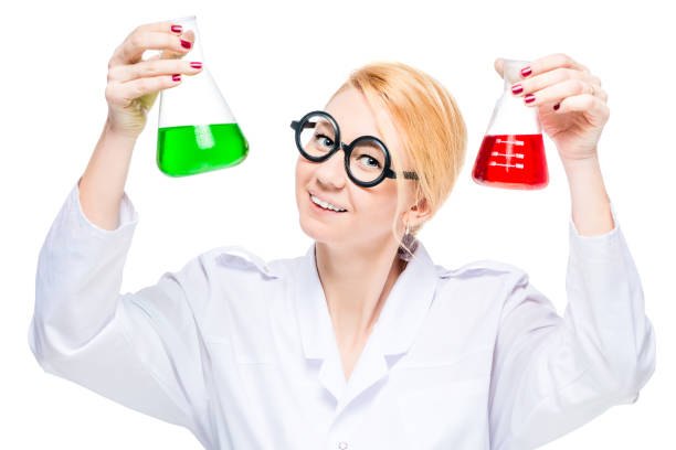 istock blonde in glasses shows a flask with liquids on a white background 862111282