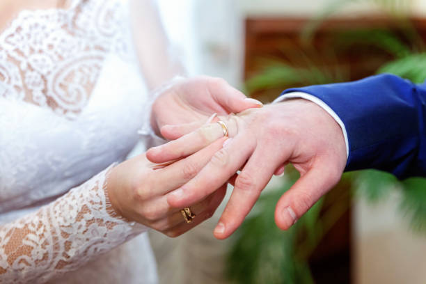 istock the bride wears a ring to the groom 862112912
