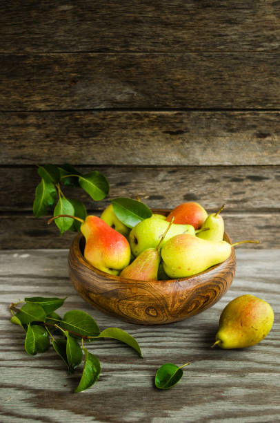 istock Ripe pears in a wooden Cup 862117420