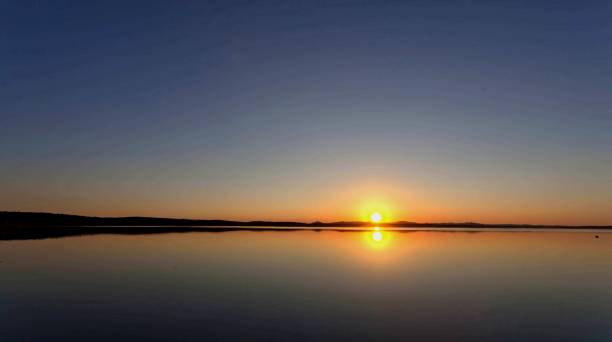 istock Golden sun sinks over the lake in the evening 862119826