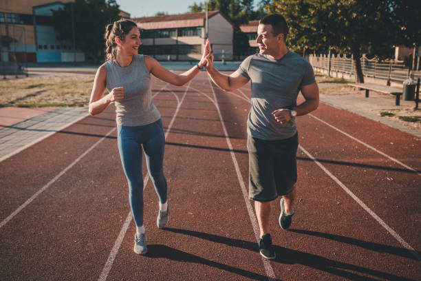 istock Two friends running together in the morning 862128334