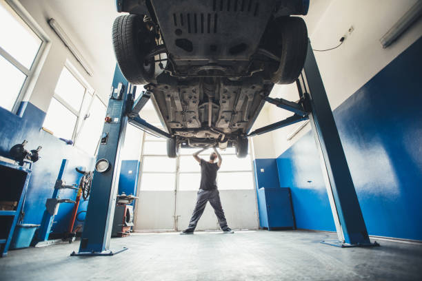 istock Mechanic working on a car indoors 862129442