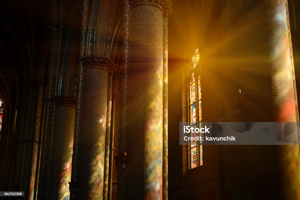 Sunlight between the columns in catholic church Sunlight through the stained glass windows in St. Ludmila of Bohemia church, Náměstí Míru, Vinohrady district. Built on plans of Josef Mocker in 1888–1892. Church Stock Photo