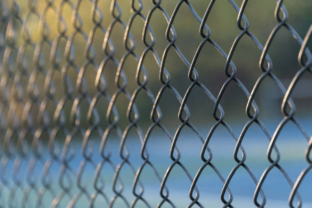 istock fence to tennis court 862135200