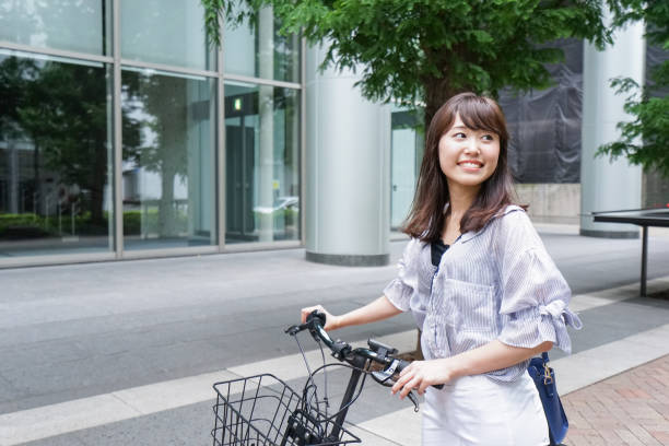 istock Woman pushing bike 862135714