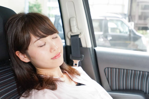 istock Woman sleeping in car 862139736