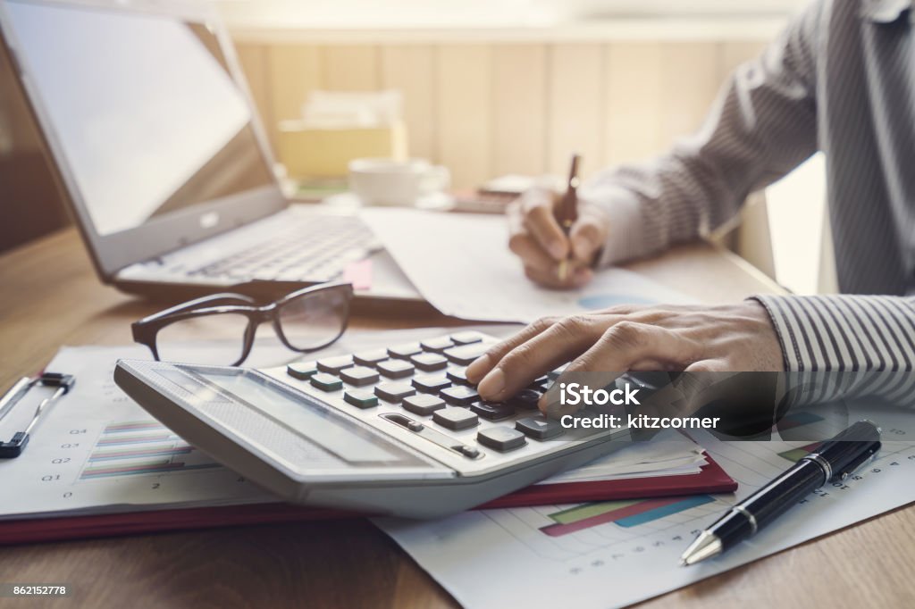 Businessman working on Desk office business financial accounting calculate Financial Advisor Stock Photo