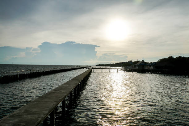 istock silhouette cement bridge at riverside in sunset 862153240