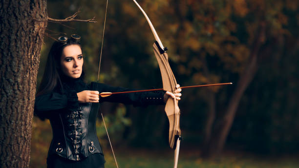 istock Female Archer Warrior in Costume with Bow and Arrow 862153766