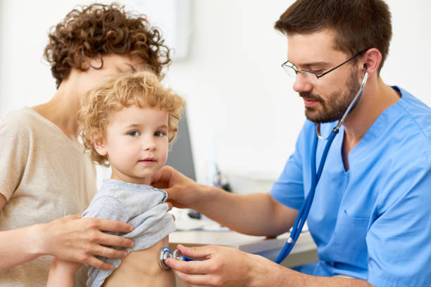 istock Doctor Examining Little Boy 862155998