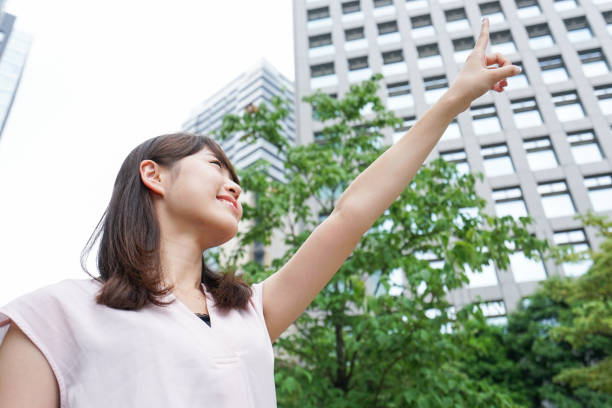 istock Young woman pointing on street 862157754
