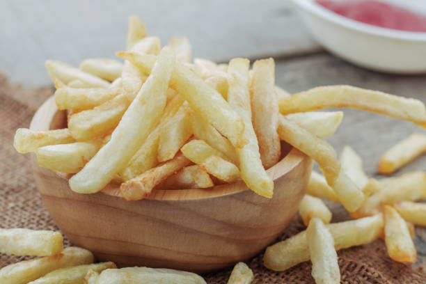 istock French fries on wooden table. 862157950
