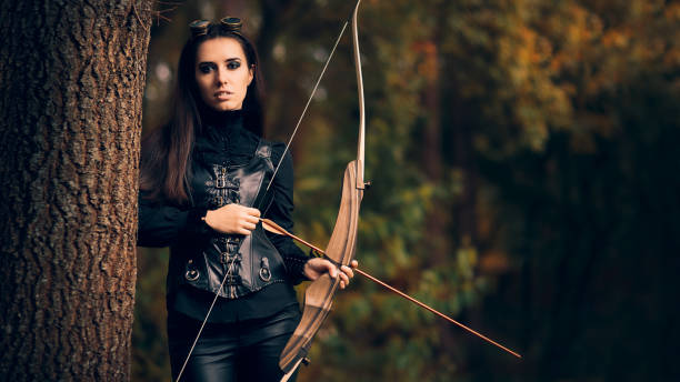 istock Female Archer Warrior in Costume with Bow and Arrow 862158140
