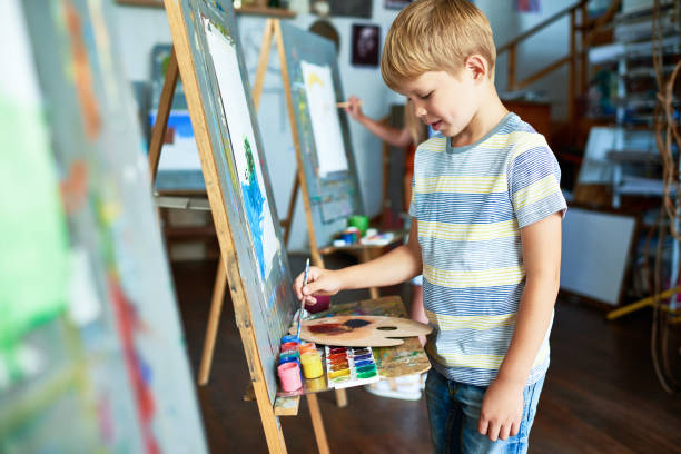 istock Little Boy Painting in Art Studio 862160384