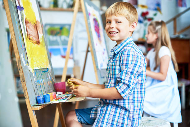 istock Smiling Little Boy in Art Class 862160388