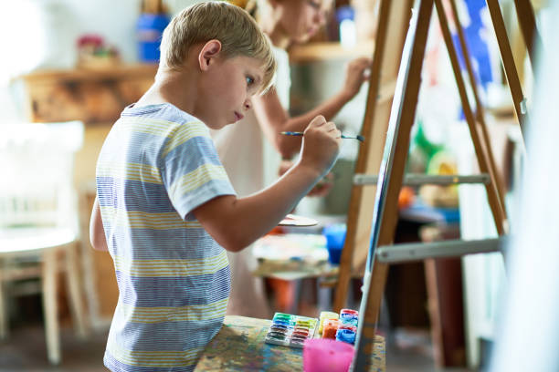 istock Talented Little Boy Painting Picture 862160396