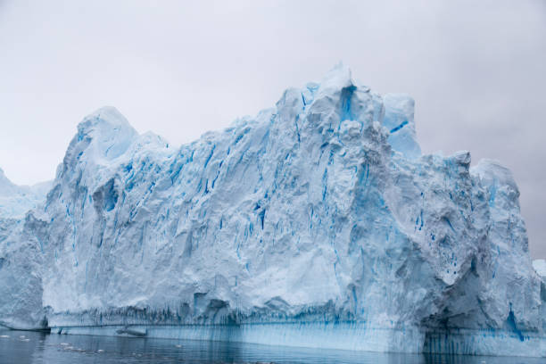 istock A huge iceberg has calved from a glacier. Showing beautiful blue ice 862160674