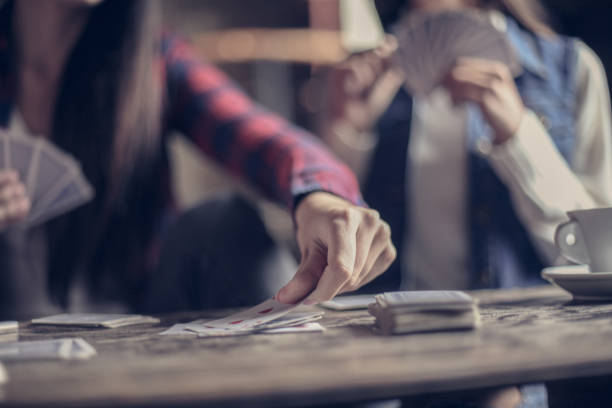 istock Girls playing game cards. Close up. 862164718