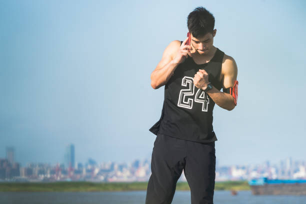 istock man wearing sportswear talking on cellphone near by river 862168122