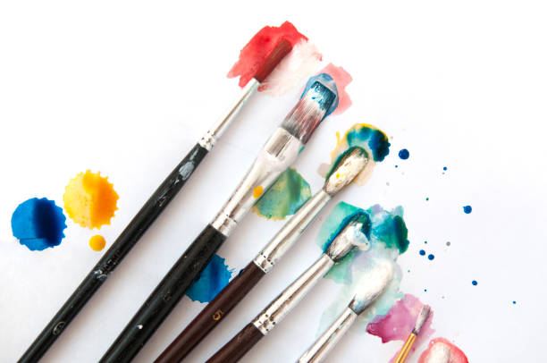 istock Many brushes in color paint on a white background. 862175834
