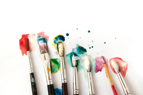 istock Many brushes in color paint on a white background. 862175876