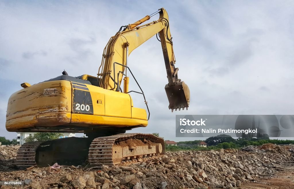 backhoe to excavate the soil on the ground backhoe to excavate the soil on the ground.construction site excavator.wheel loader,backhoe loader,dig the ground Activity Stock Photo