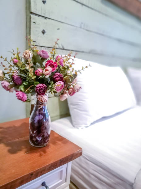 istock Vase of artificial flower decoration on table in modern rustic Bedroom 862179100