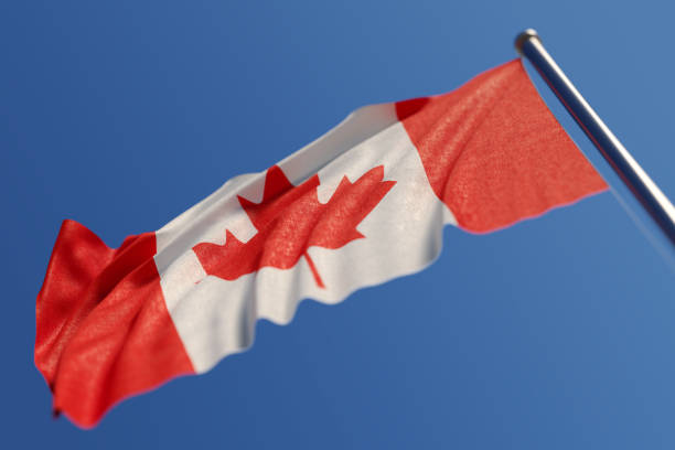 istock Canadian Flag Waving With Wind On Blue Sky 862179162