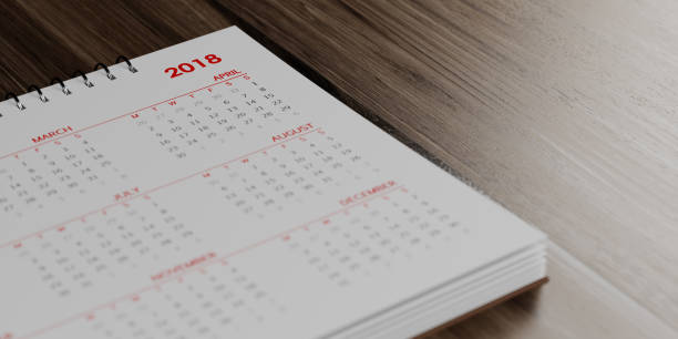 istock White Calendar On  Brown Wood Surface 862180008