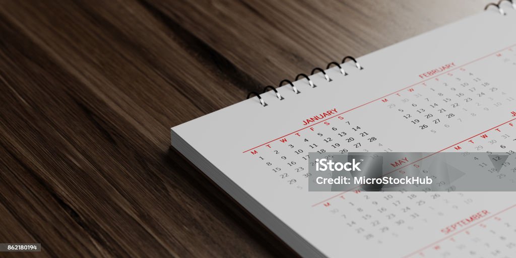 Blanco calendario sobre superficies de madera marrón - Foto de stock de Calendario libre de derechos