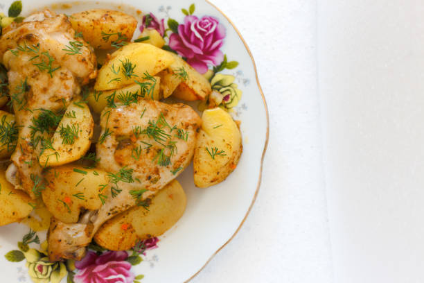 istock Barbecued chicken leg with boiled potatoes . 862180516