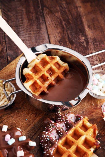 istock Belgium waffles with chocolate sauce. popsicles with chocolate and wafer 862188374