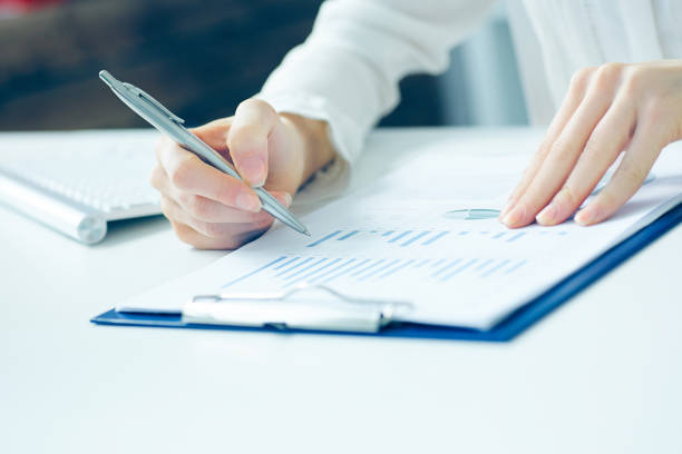istock The girl is studying the economic indicators on the chart. 862188892