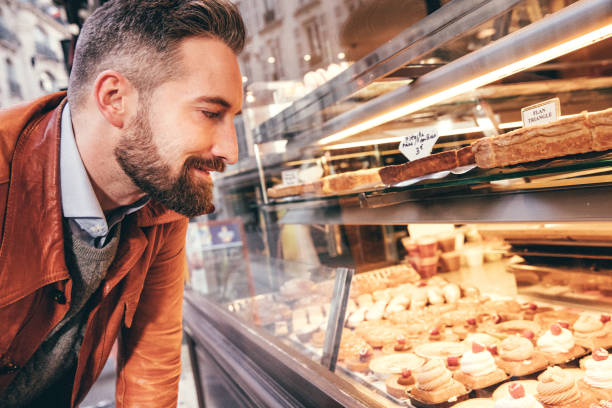 istock Young man choosing sweets in Paris, France 862189494