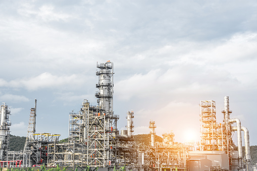 Close up Industrial zone. Plant oil and gas refinery industry. Petrochemical factory  area with the sunlight sky background.