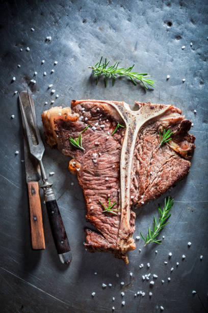 istock Fresh tbone steak with salt on metal table 862196198
