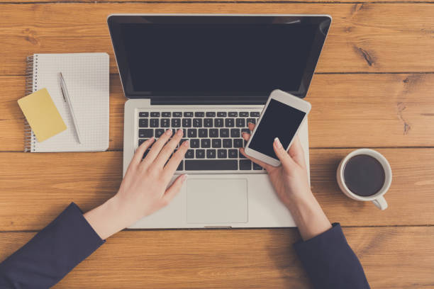 istock Woman using laptop in coffee shop, close-up 862197368