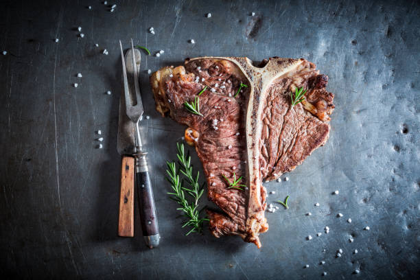 istock Fresh tbone steak and chips with salt and rosemary 862199332