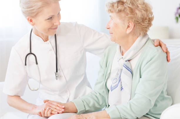 istock Elderly looking at smiling doctor 862200716