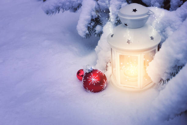 istock Little winter lanterns outdoors on a Christmas tree under snow, space 862200792