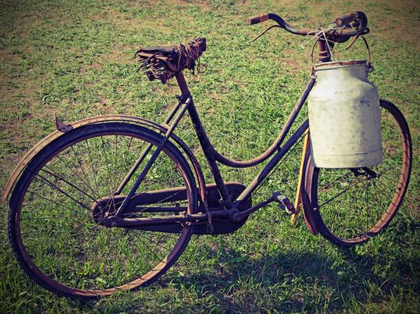 istock old bicycle with a broken saddle and the milk can milkman 862201164