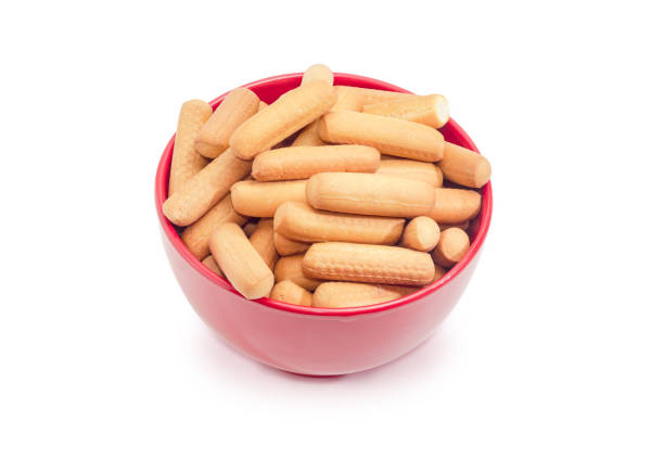 istock Cookies in the form of sticks in a red bowl 862201178