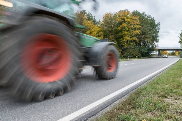 istock Tractor passing by on a national highway, Germany 862201782