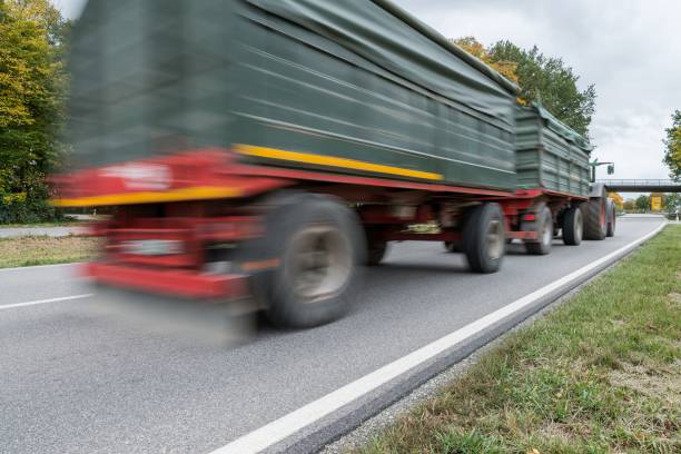 istock Tractor passing by on a national highway, Germany 862201802