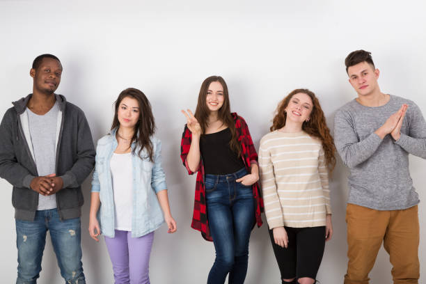 istock Group of diverse students standing in line indoors 862202624
