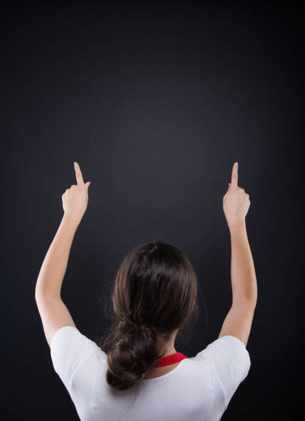 istock Back view of female employee indicate to dark background 862202632